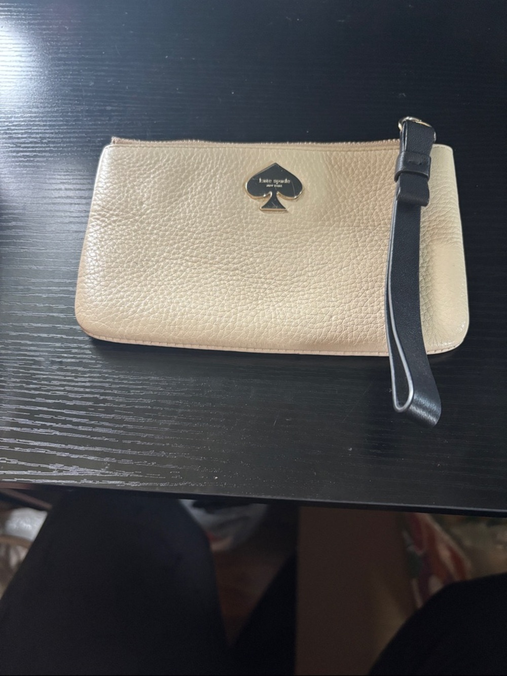 kate spade cream  pebble leather wristlet with black strap